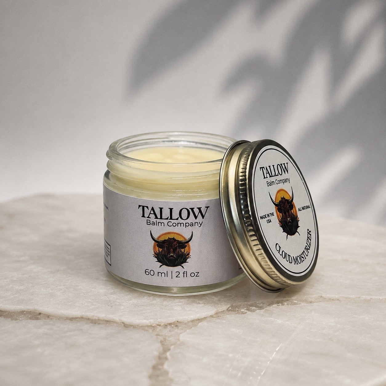 Open jar of Cloud Moisturizer, a beef tallow face moisturizer made with USDA Organic 100% Grass-Fed & Finished Tallow.
